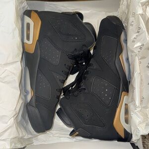 Jordan Black and Gold Sneakers